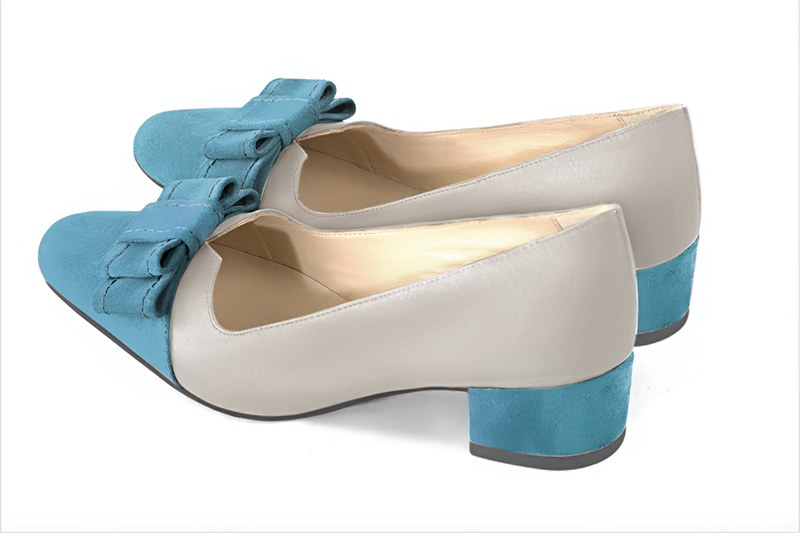 Peacock blue and pearl grey women's dress pumps, with a knot on the front. Round toe. Low block heels. Rear view - Florence KOOIJMAN